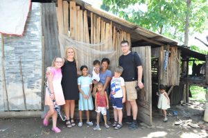 andreasen-family-with-cherrys-family-outside-their-house